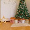 Decorated room for Christmas holidays - Gifts under Christmas tree and white wardrobe and covered armchair Christmas Dreamy Backdrop
